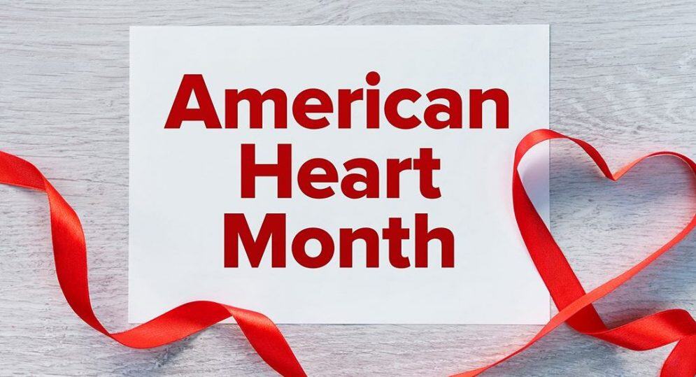 American Heart Month with red ribbon heart.