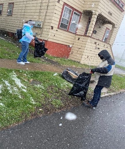 Volunteers picking up litter in snowy weather