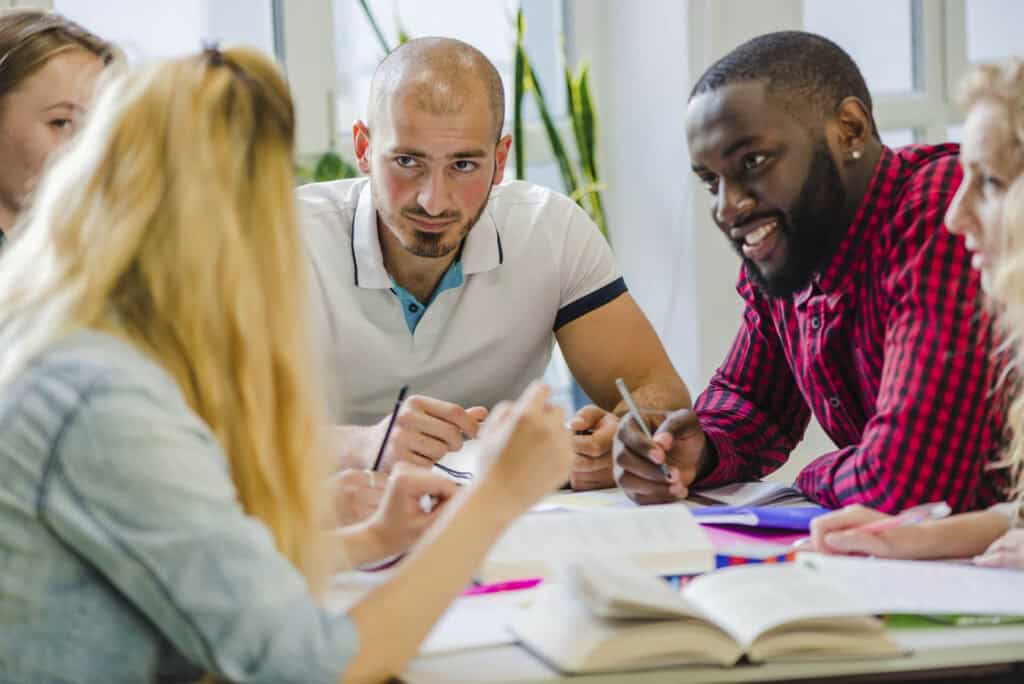Group of people collaborating at table.