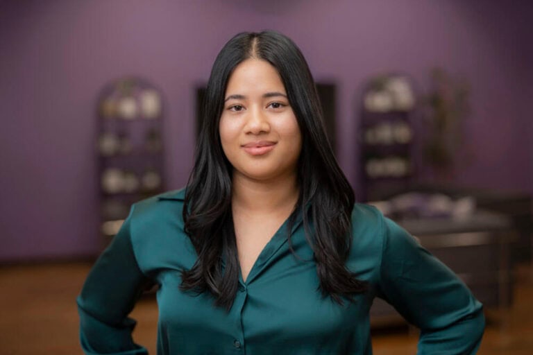 Person standing confidently in office setting