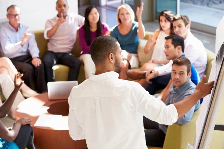 Diverse team in a collaborative meeting session.