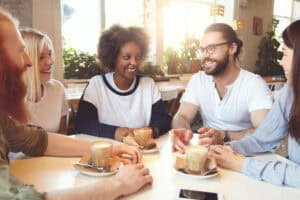 Group of friends enjoying coffee and conversation.