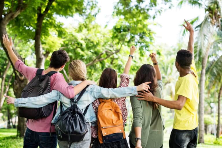 Group of friends celebrating outdoors in park