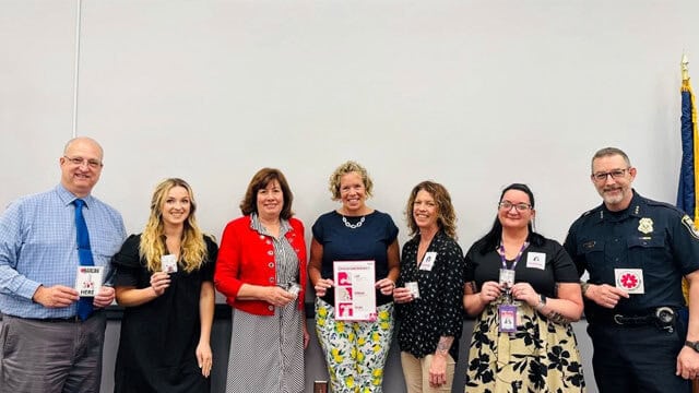 Group holding emergency response cards together.