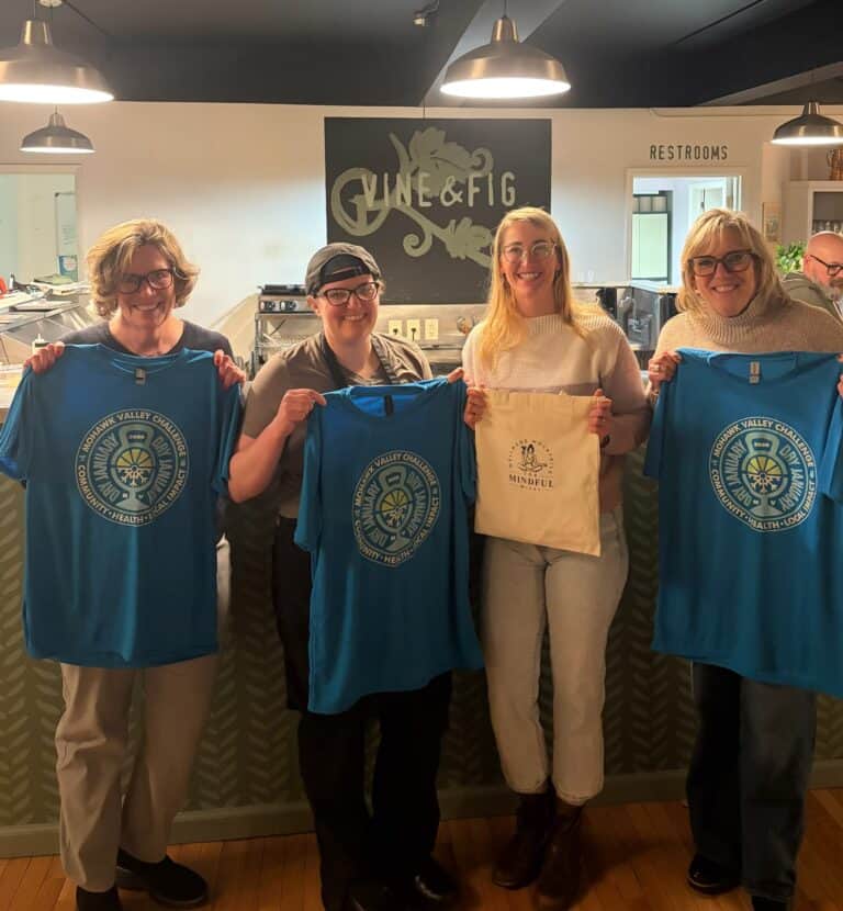 Dry January_CFLR_Vine&Fig Group holding blue shirts at Vine & Fig