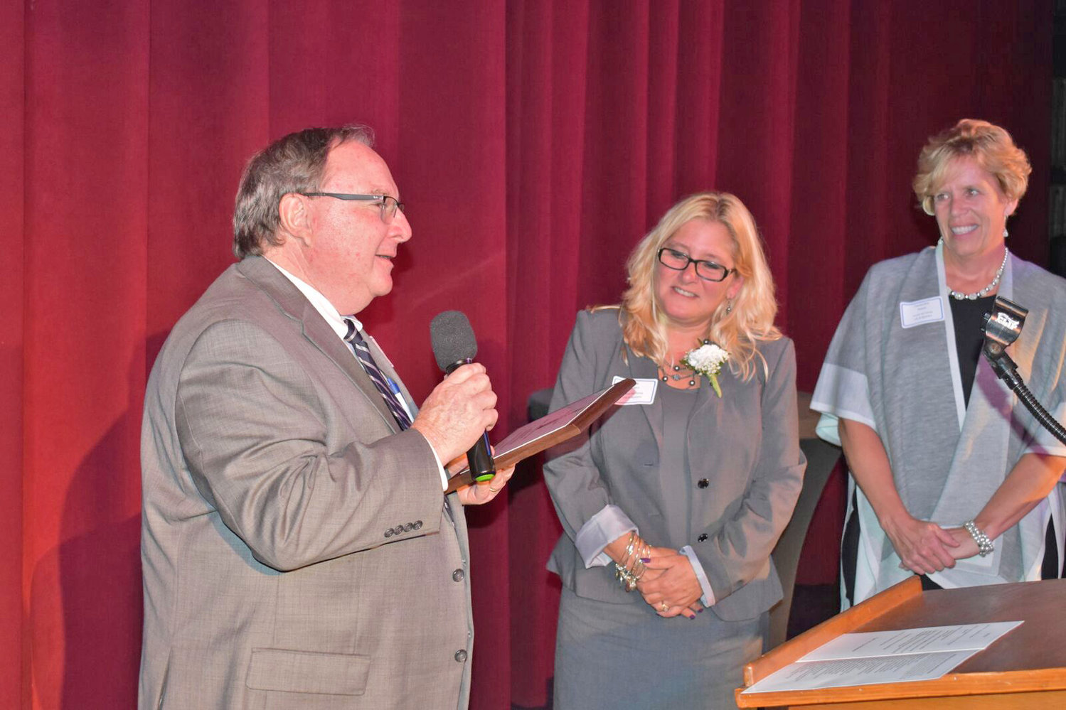 Rome Community Foundation President David Grow presents the Richard H. McMahon Governance Award to Kelly Walters